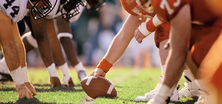 Pro football players on a football field.