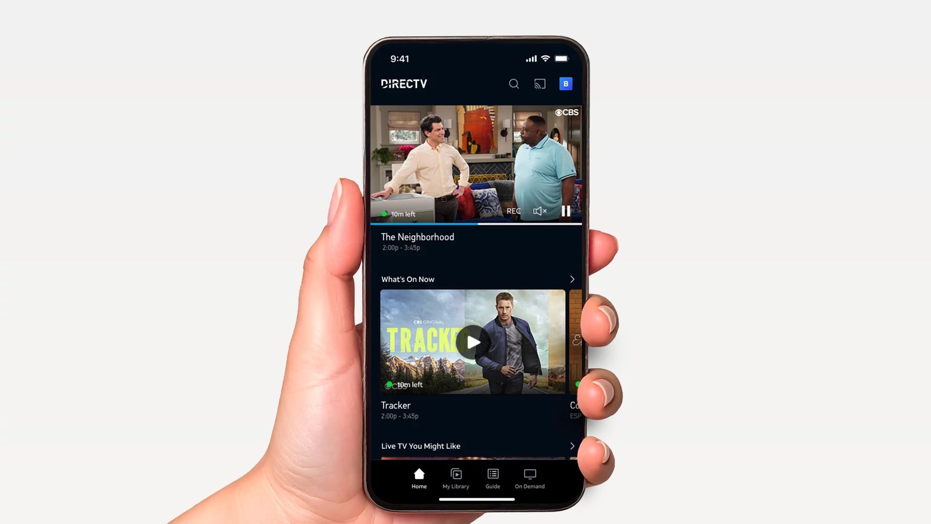 Hand holding smartphone displaying the DIRECTV app with on-demand TV shows and movies.